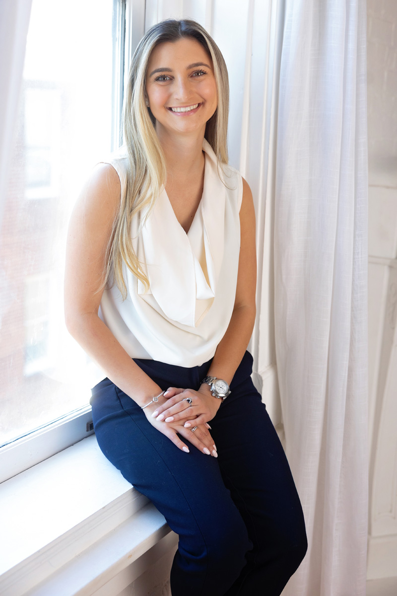 Founder of You Creative Co. working on a laptop